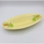 A Clarice Cliff serving dish with corn design.