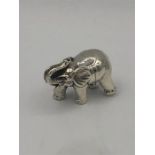 A sterling silver miniature figure of an elephant.