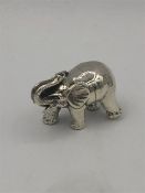 A sterling silver miniature figure of an elephant.