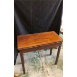 A dark wood hall table