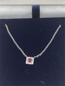 An 18ct gold ruby and diamond pendant necklace 40pts.