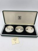 A 1975 Royal Mint silver proof set of 50 Dirham three coin set.