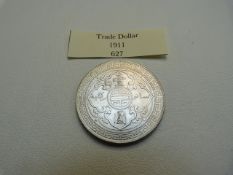A 1911 1 dollar, silver Chinese Design with Britannia to reverse.
