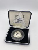 A 1998 Bermuda silver proof Triangular $3 coin.