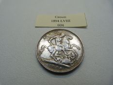 An 1894 Great Britain silver crown (LVIII) VF Victoria with George and the Dragon to reverse.