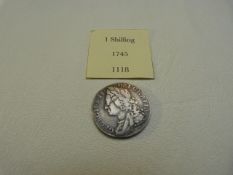 A Great Britain 1745 1 Shilling coin, silver, George II with Four Shields to the reverse.