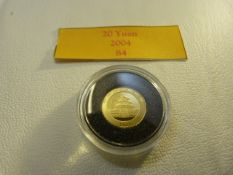 A Chinese 2004 gold 20 Yuan coin (UNC)