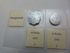 A selection of fourteen coins from Bangladesh from 1974, various denominations.