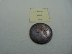 An 1860 Great Britain 1 Penny Victoria with Britannia to reverse AUNC