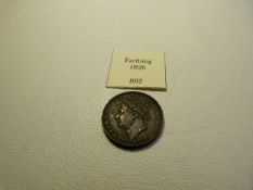 An 1826 Great Britain Farthing AEF George IV with Britannia to reverse.