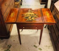 An Oriental games table with front drawer with ivory handles on castors with engraved scene on top