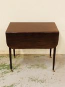 A Mahogany Pembroke table on brass castors.