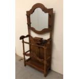 Large ornate carved Hall Stand with leather detailing and carved detail and inset mirror.