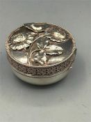 A Sterling silver pill box with foliate and filigree decoration