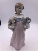 A Lladro figure 'Arms full of love', girl with two dogs (22cm)