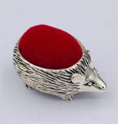 A Silver Hedgehog pincushion