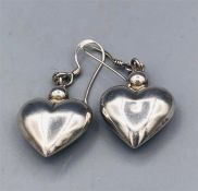 A Pair of silver heart earrings
