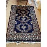 A Blue rug 189cm x 125cm (Made in Pakistan)