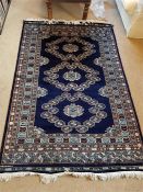 A Blue rug 189cm x 125cm (Made in Pakistan)