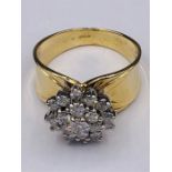 A 14ct yellow gold diamond daisy style cluster ring over 1CT