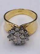 A 14ct yellow gold diamond daisy style cluster ring over 1CT