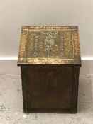 A Brass, coal bin, in a hammered style.