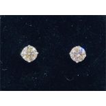 A Pair of 14ct white gold diamond stud earrings of 86 points approx.