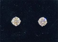 A Pair of 14ct white gold diamond stud earrings of 86 points approx.