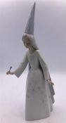 A Lladro figure of a Fairy in hat with a wand (28cm)