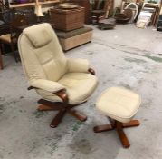 A Cream leather armchair with matching footstool