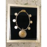An Arabian silver necklace in a box frame