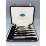 A Boxed set of six Sterling silver handled butter knives, Sheffield 1964