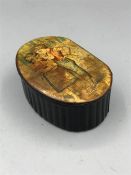 A papier mache snuff box