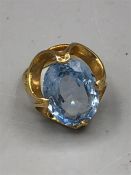 A 9ct yellow gold Aquamarine style ring