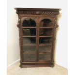 A Large carved corner cabinet with five shelves.