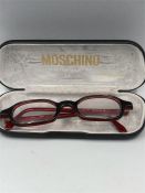 A pair of Vintage Moschino glasses in original case.