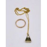A 9ct gold necklace with a handbag pendant (1.1g) and a 9ct gold wedding band (1.6g)