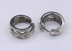 A Pair of silver and CZ hoop earrings