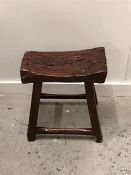 A rustic stool.