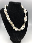 A contemporary silver necklace