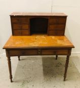 A Two drawer desk with additional drawers above and marble top