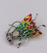 A Silver and Plique A Jour Moth Brooch