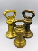 A selection of three antique brass weights