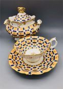 A china lidded soup tureen and tea cup and saucer.