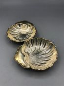A pair of Sterling silver shaped butter dishes
