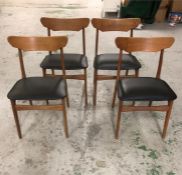 A set of four dining chairs in teak and black faux leather by Schionning & Elgaard, original 1960'