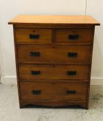 A Two over three drawer chest of drawers with drop handles.