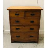 A Two over three drawer chest of drawers with drop handles.