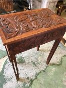 An Arts And Crafts carved sewing box 73cm H 34cm D 56cm W