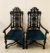 A Pair of carved oak chairs 133cm High x 68 cm wide